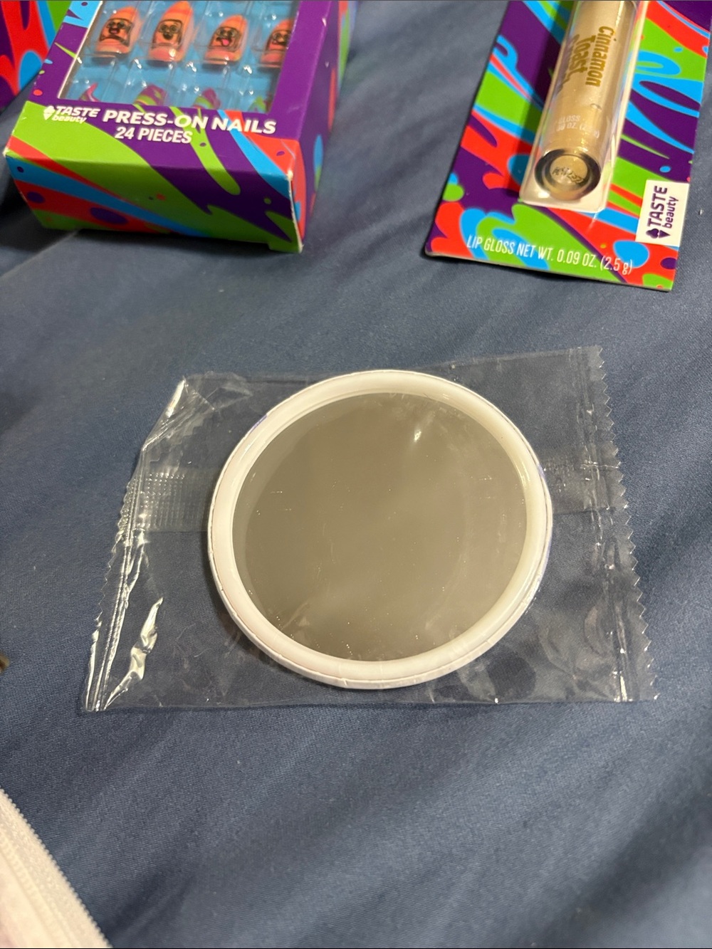'Pouch with mirror, socks, Cinnamon Toast Crunch items and Trader Joe’s lip duo - Picture 10 of 11
